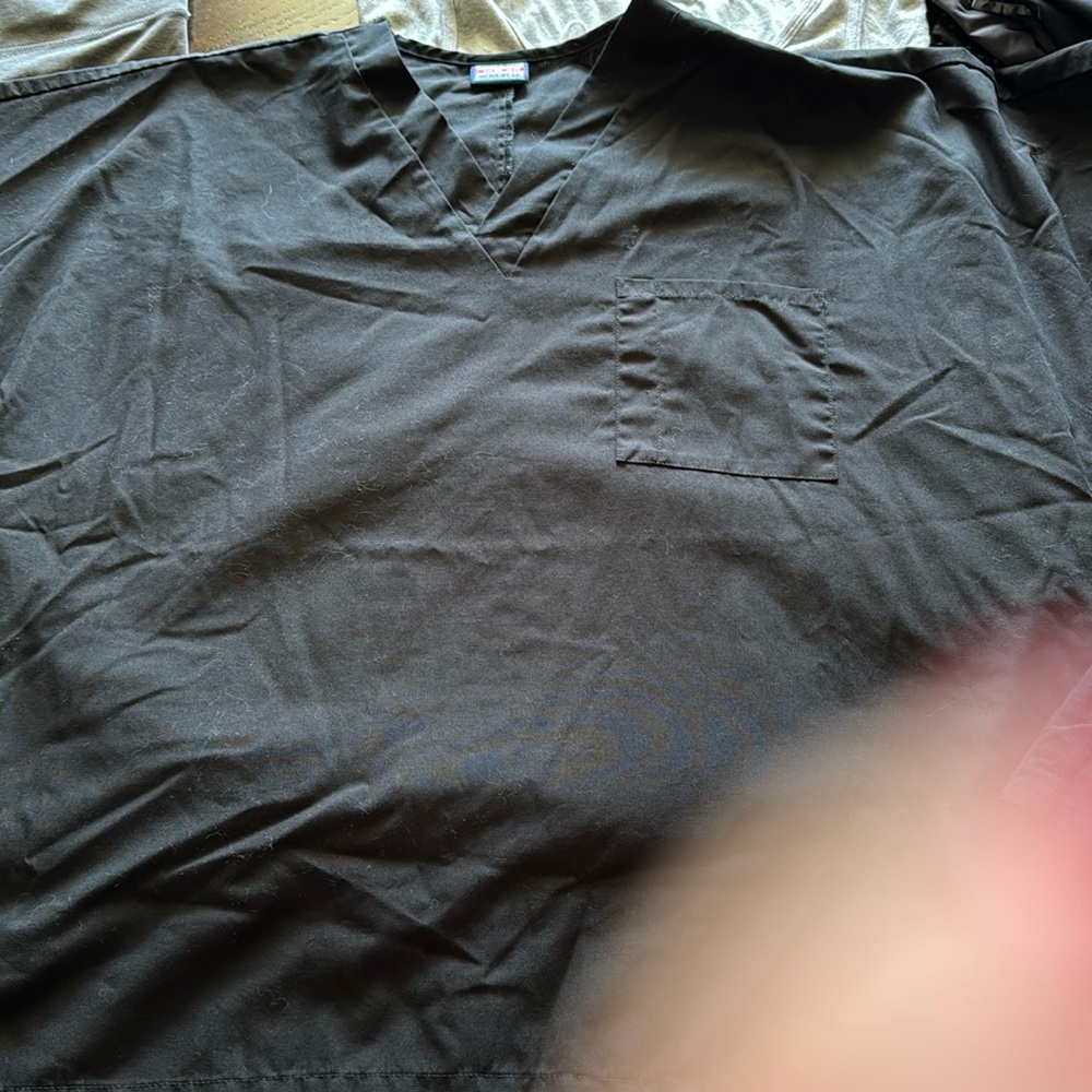 No longer wear. Cherokee black scrub top wrinkled from storage.